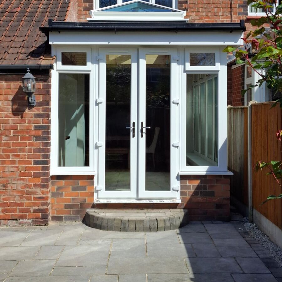 Small extension with French doors and a roof lantern