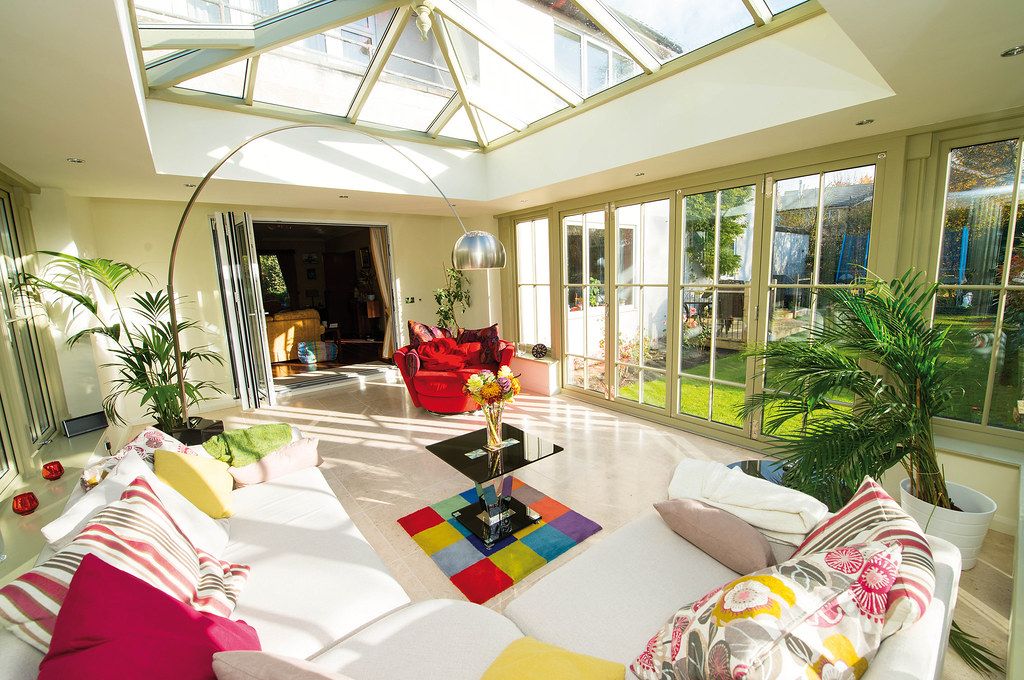 Gable fronted conservatory at dusk with lights on